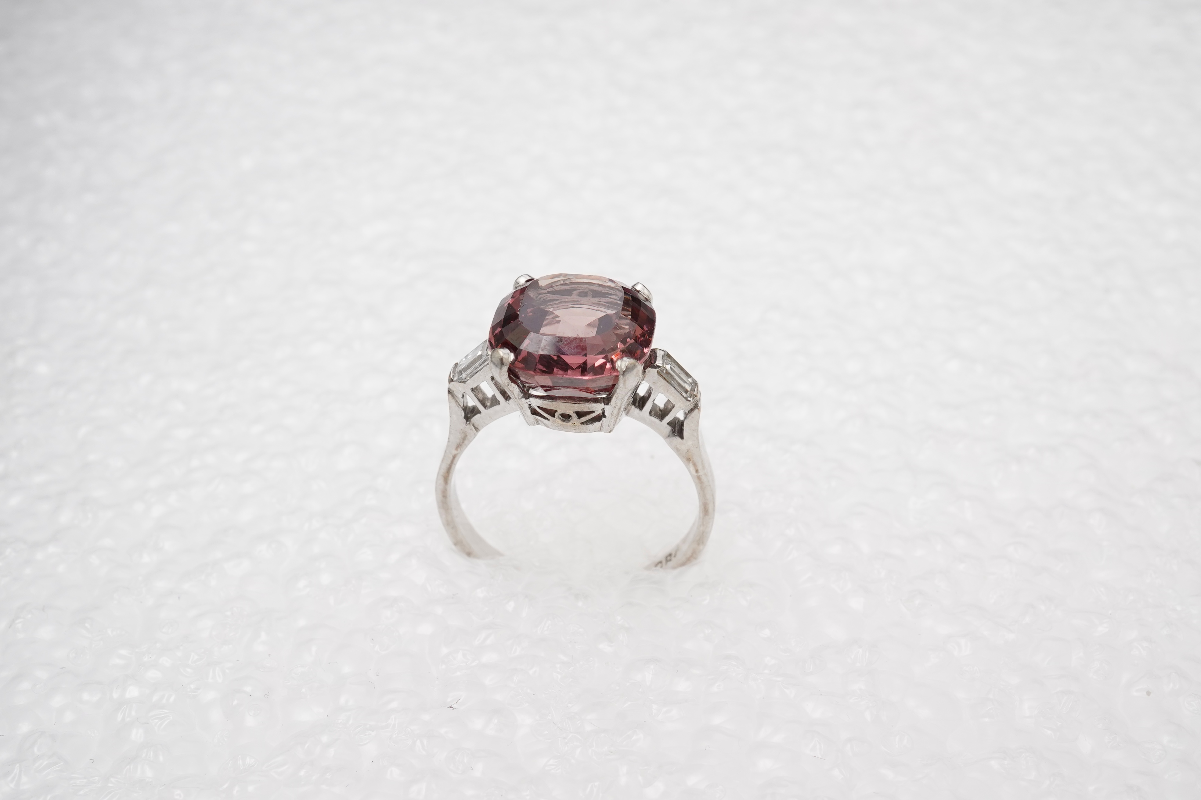 A garnet and diamond ring